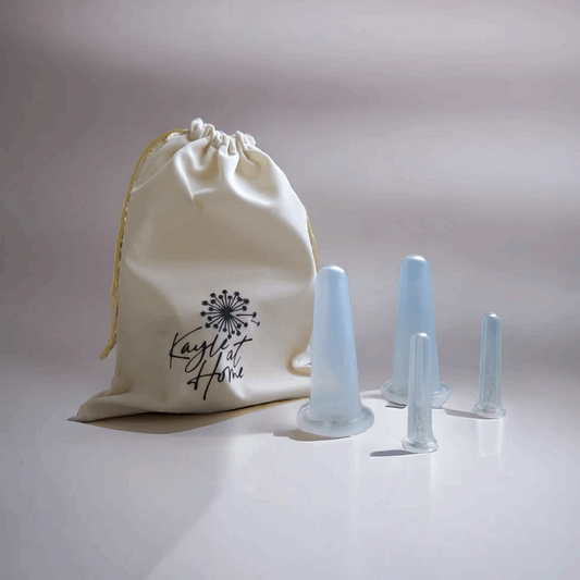 a white bag with cupping tools next to it