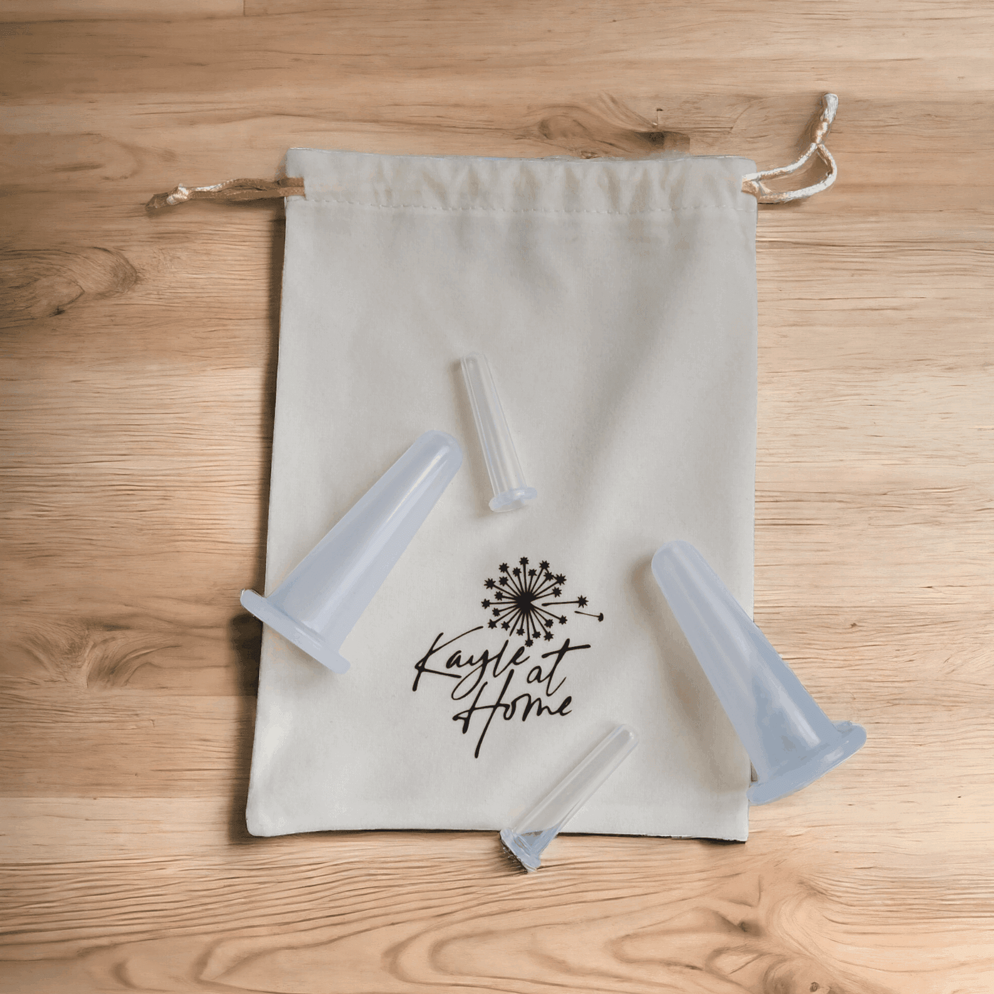 a drawstring bag with cupping tools on top of it