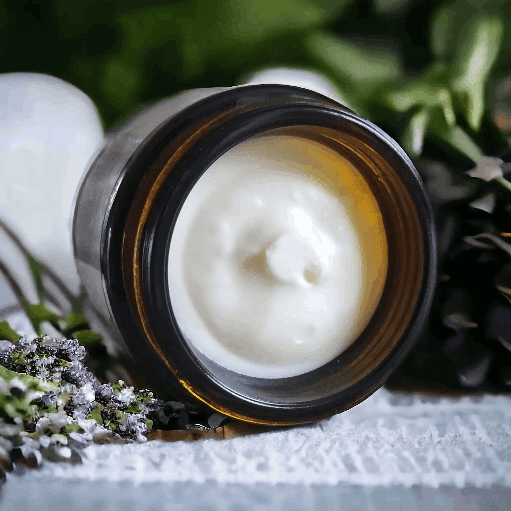 a jar of cream sitting on top of a table