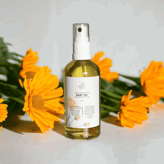 a bottle of Baby oil with calendula flowers